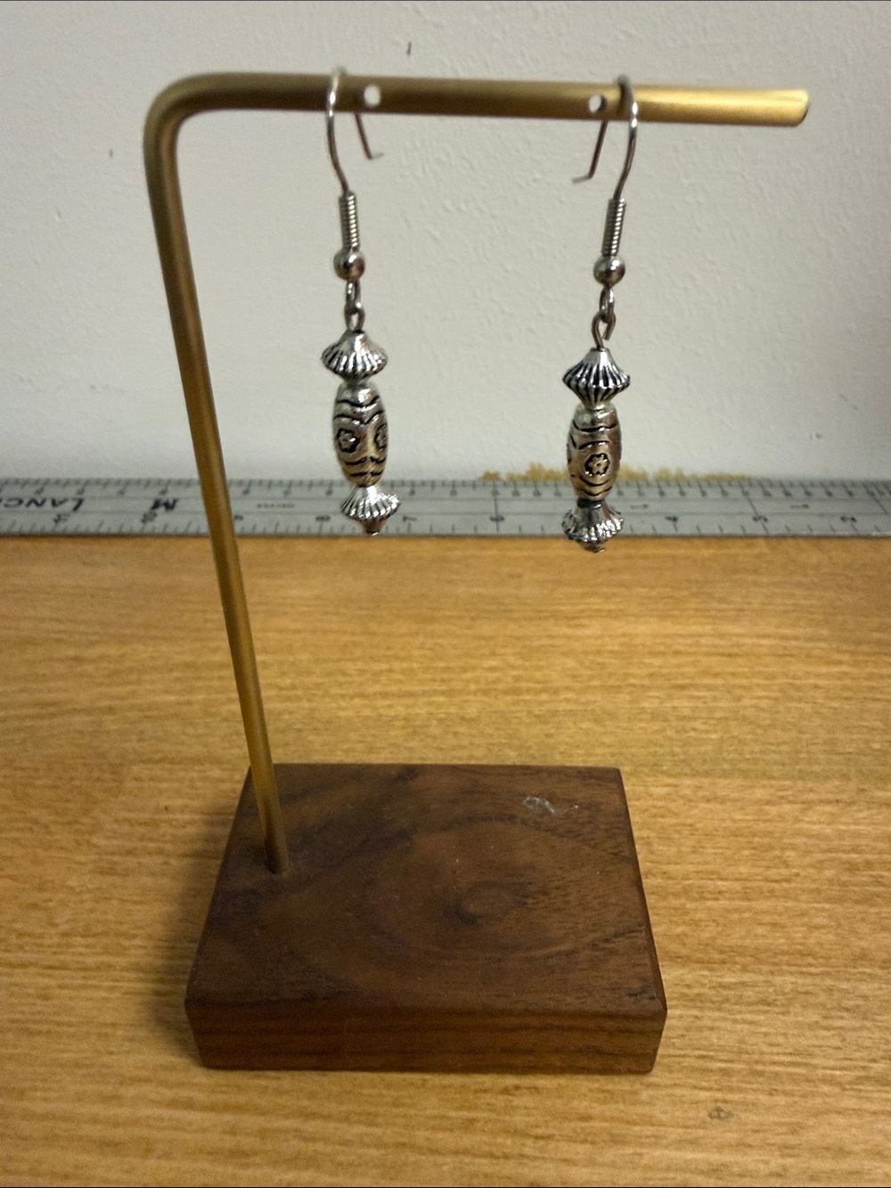 Silver tone dangle drop earrings with primitive markings drawings